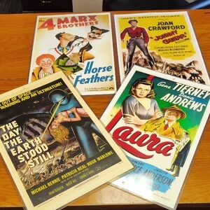 Four Vintage Movie Posters In Plastic Sleeves
